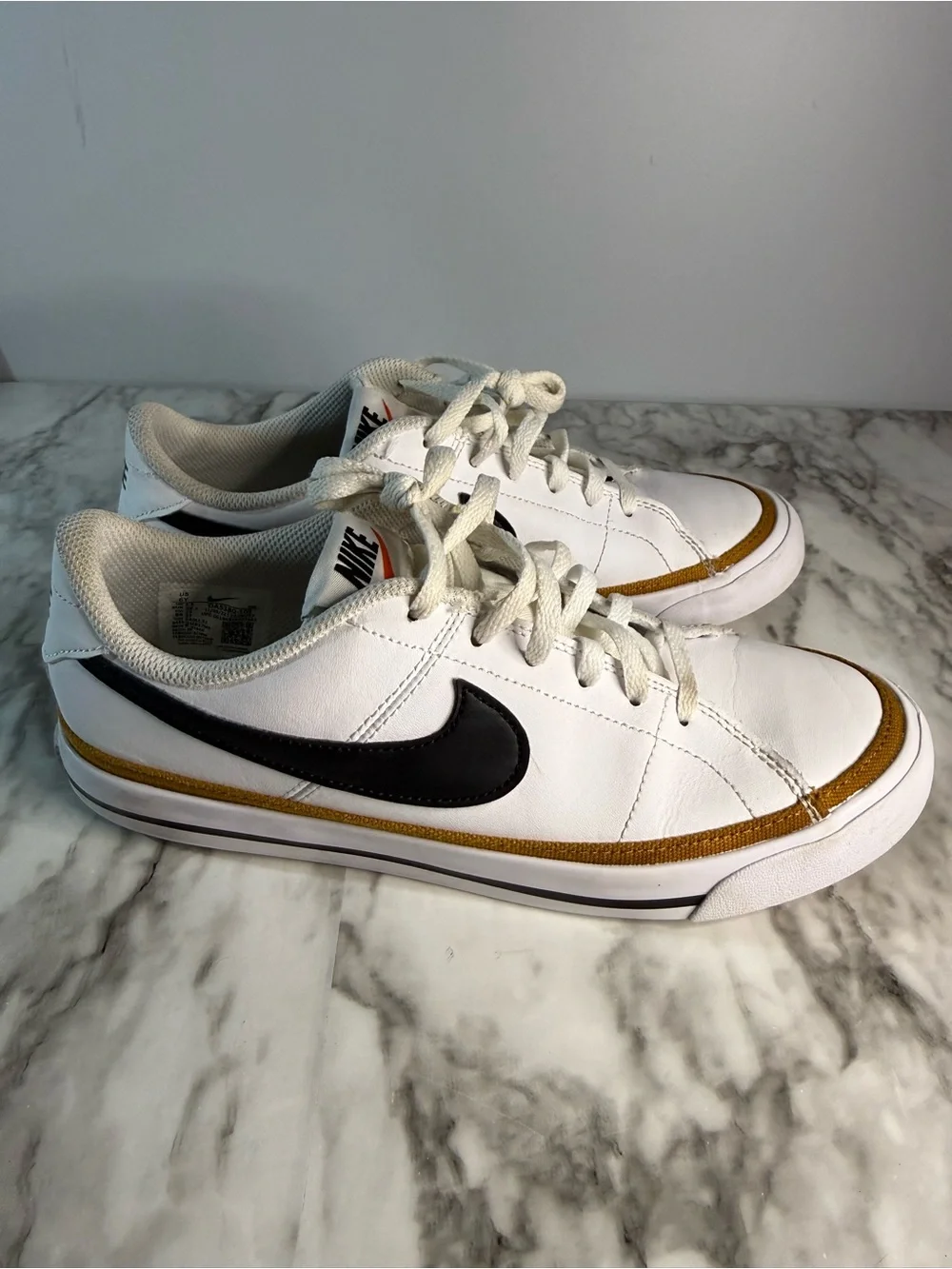 Nike kids White Leather Sneakers with Black Swoosh and Gold Accent